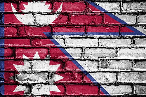 Nepal flag on brick wall background