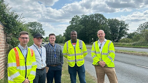 Cameron and Richard standing for road safety on the A38
