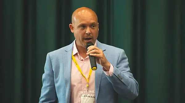 Cameron Thomas with microphone