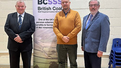 Cameron Thomas stands with members of the British Coal Staff Superannuation Scheme