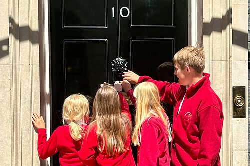 Children from Aston Rowant Primary School hand in a class petition to Number 10